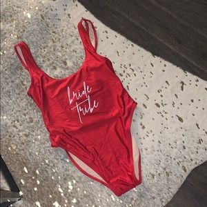 Red Ravesuit that say Bride Tribe